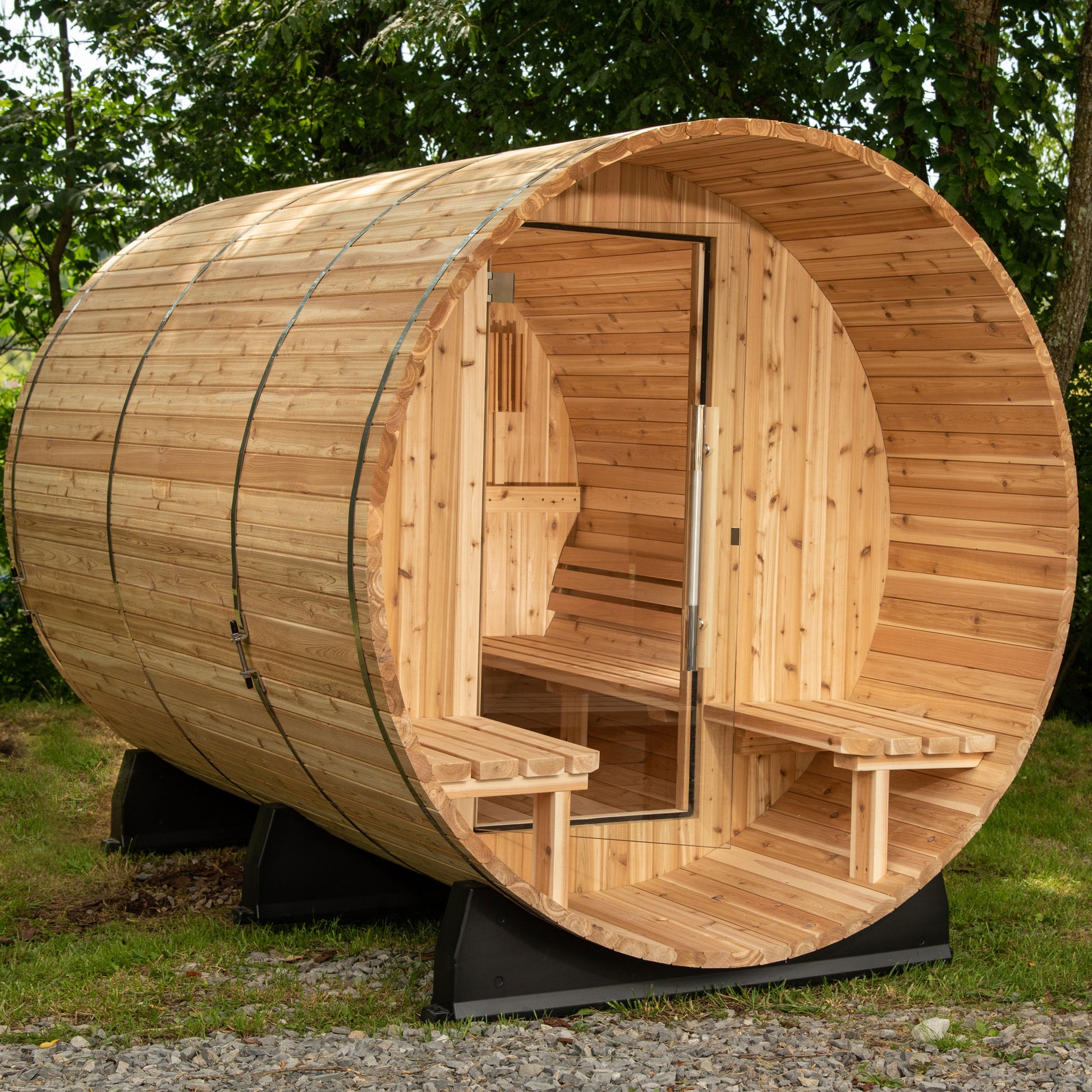 Outdoor Charleston Canopy Barrel sauna with a glass door.