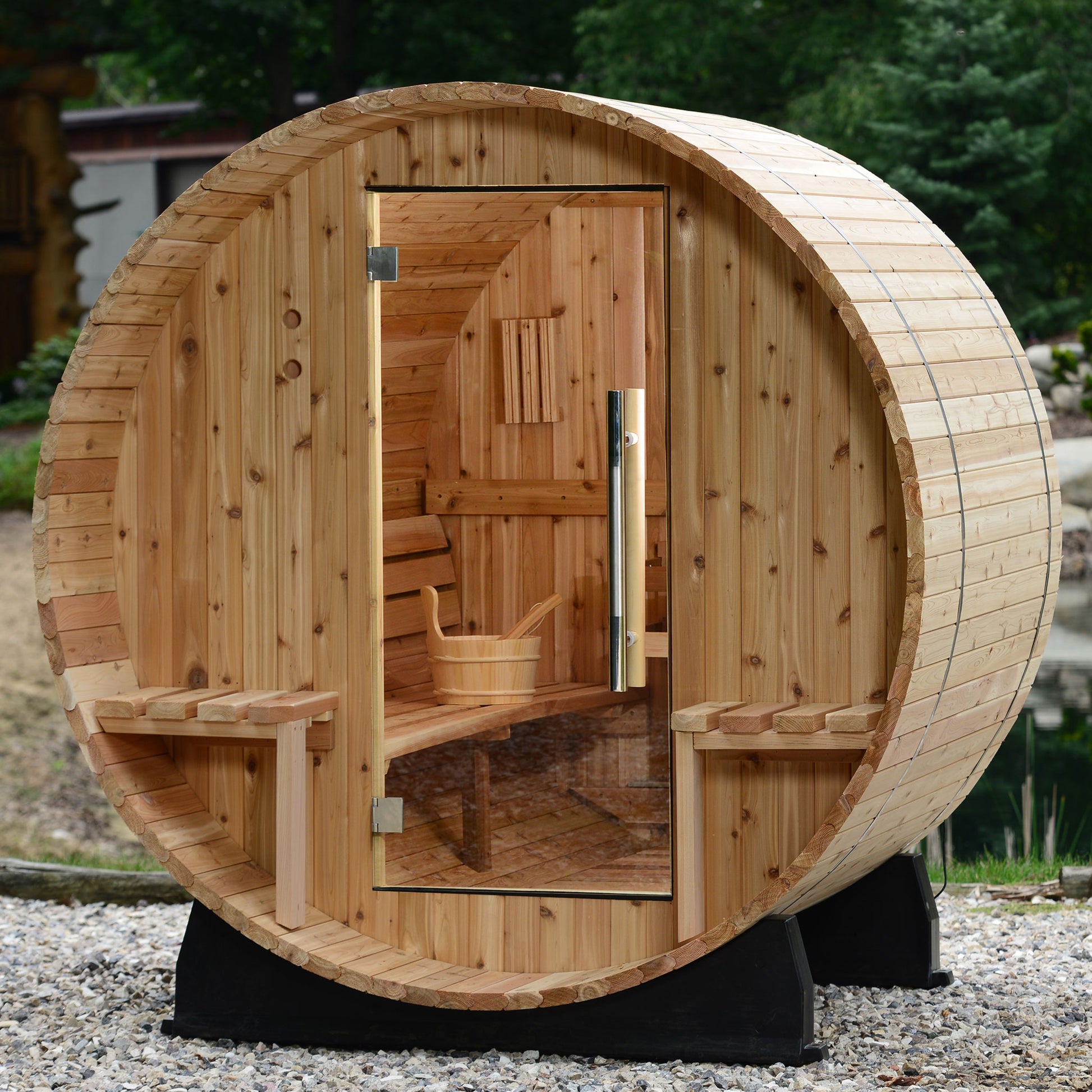 Vienna 2-person Canopy Barrel Sauna with sauna accessory inside.