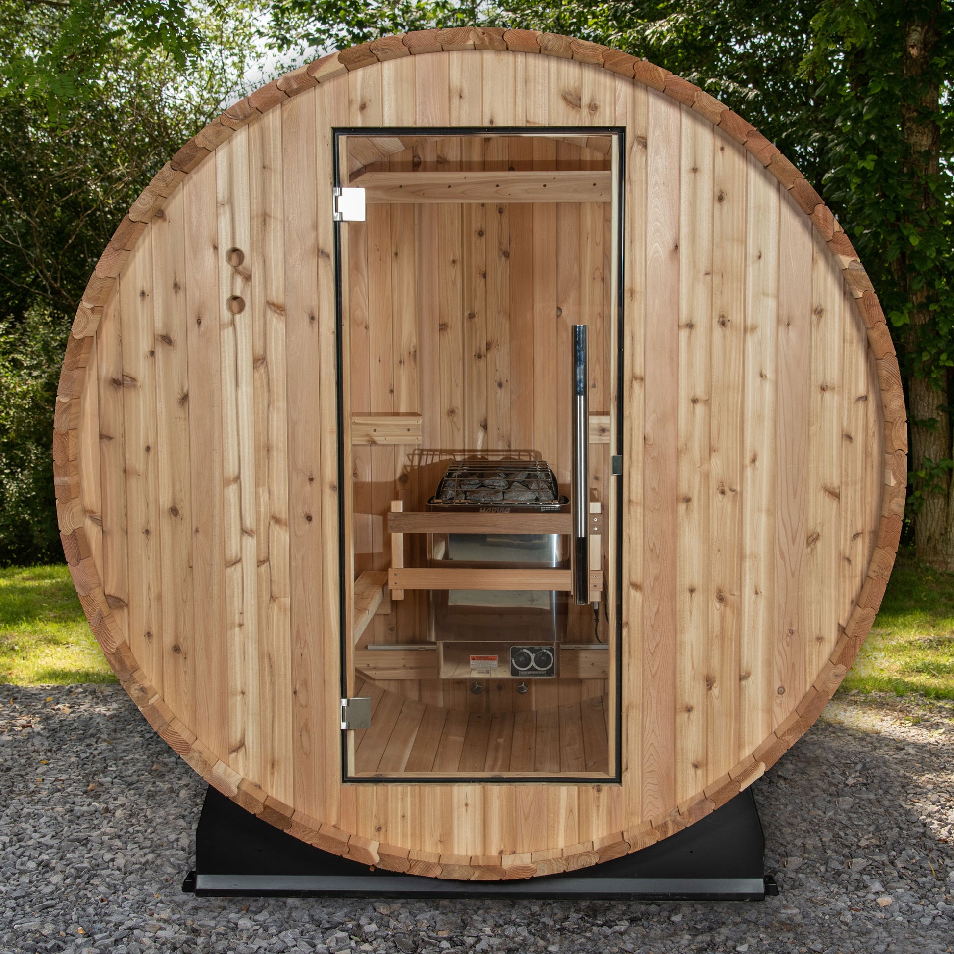 Classic Watoga Barrel sauna with glass door and stainless steel door handle.